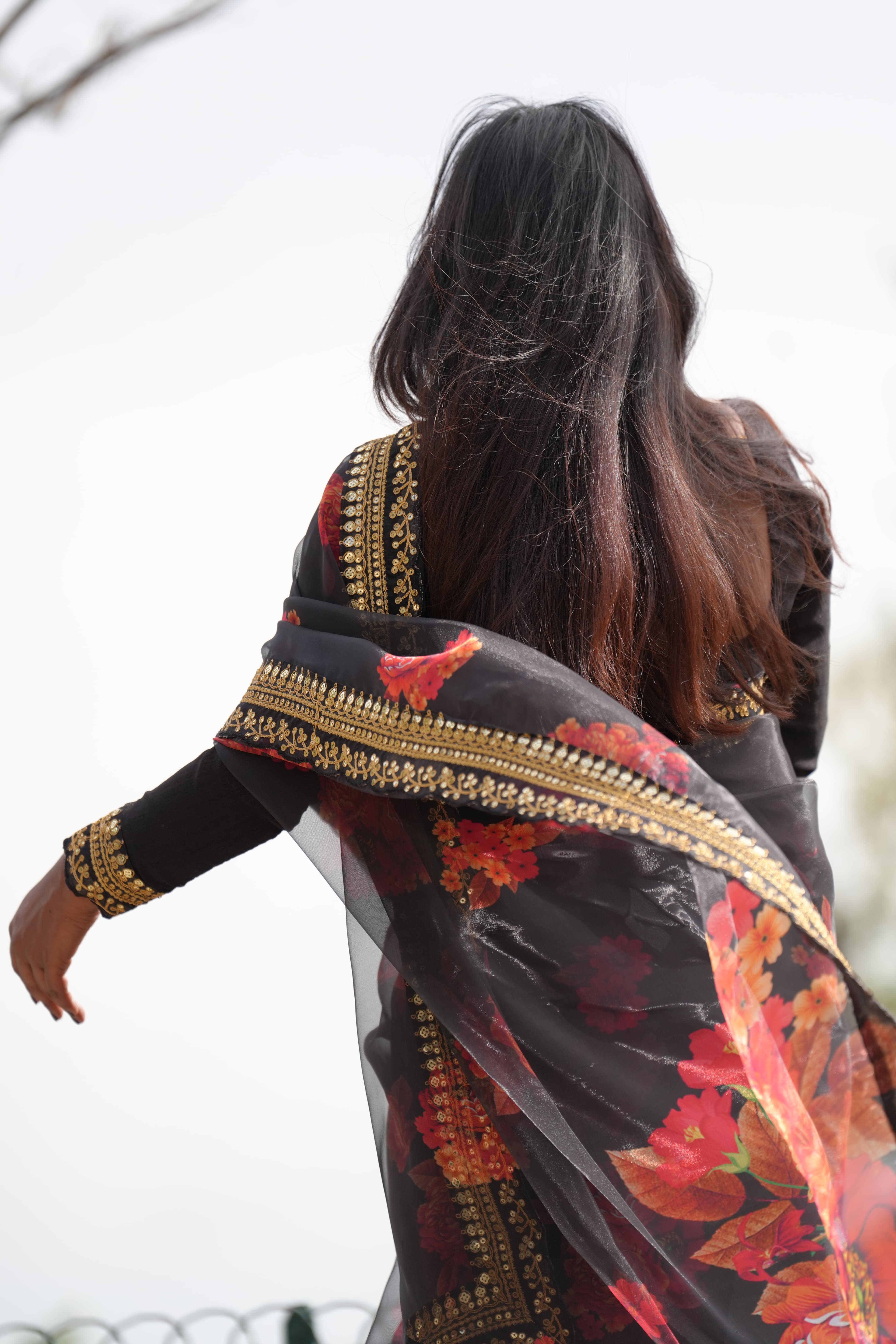 Black saree against a quiet backdrop